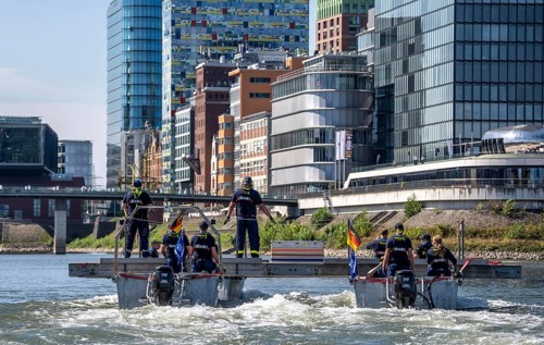 Exercise run of a multi-purpose pontoon on the Rhine, Medienhafen, the skipper gives instructions