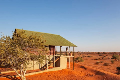 Some of the chalets of the Bagatelle Kalahari Game Ranch are built on top of a sand dune. Kalahari