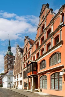 Magnificent row of houses with gables, St Nikolai Church tower at the back left, Old Town,