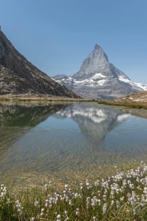 A marvellous view of the Matterhorn, which lies majestically above a calm lake and reflects its