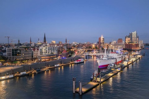 Aerial view of the Landungsbrücken Hamburg (Jan-Fedder-Promenade) at blue hour with Elbe, Cap San