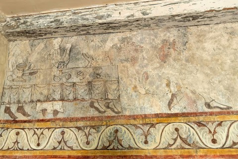 Saint Jean Chapel features ancient wall paintings showcasing religious figures with vibrant colors
