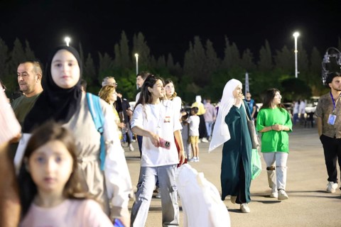 Audience members enjoy a musical performance during the Damascus International Fair in Damascus,