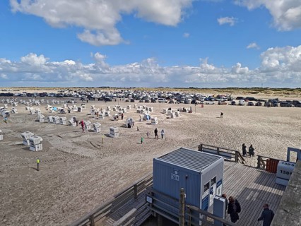 North Sea beach, car park, parking machine, blue sky, white clouds, summer, sun, sand, beach