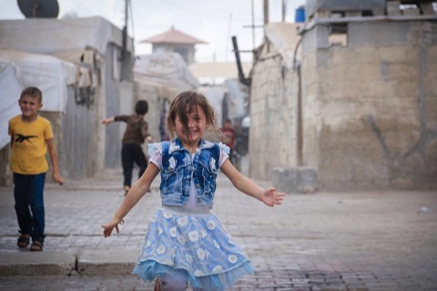Syrian children playing in a refugee camp near the Turkish border on World Children's Day. Aleppo,