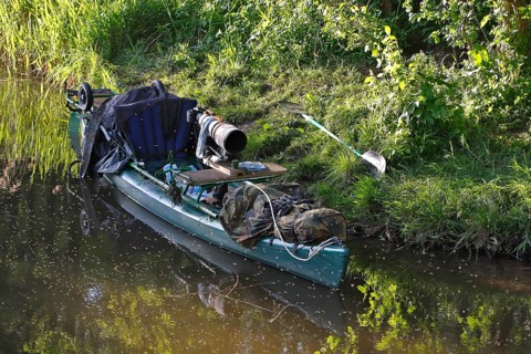 Kayak of a nature photographer in the water, Müritz National Park, Mecklenburg-Western Pomerania,