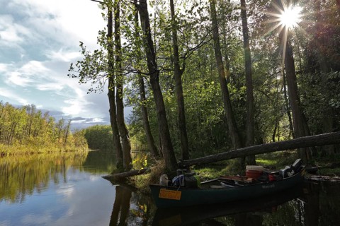 Canoe by nature photographers in Drosedower Bek, Müritz National Park, Mecklenburg-Western