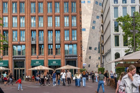 The Grote Markt in the old town of Groningen, modern facades of hotel and commercial buildings, in