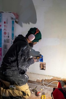 Detroit, Michigan - Workers remodel a house in the Morningside neighborhood that had been vacant