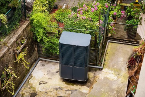 Heat pump in a backyard in Wuppertal, Germany, digitally reworked