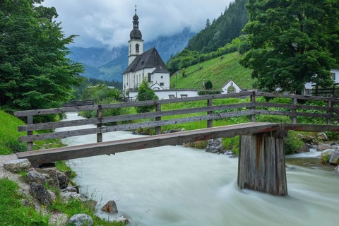 St Sebastian in Ramsau in Berchtesgadener Land with rain clouds after heavy rain