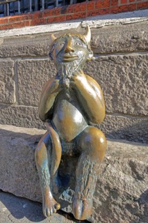 Sculpture Devil by Rolf Goerler 1999 sitting on the Devil's Stone, bronze sculpture, modern art, St