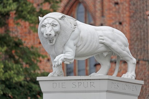 White Lion Monument by Peter Lenk 1996 with inscription The Trace of the Lion and monument to the
