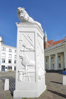 White Lion Monument by Peter Lenk 1996 with inscription The Trace of the Lion and monument to the