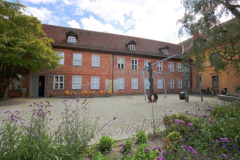 Cultural Forum and Schleswig-Holstein House, brick building, sculpture, inscription, Schelfstadt,