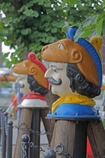 Colourful Swedish heads as landmarks, historical wooden head with face and four eyes, Swedish head