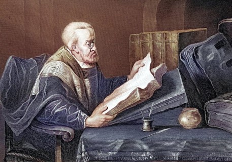 A scholar with a book at a desk, reading, Elderly man reading intently in a book, quiet study room