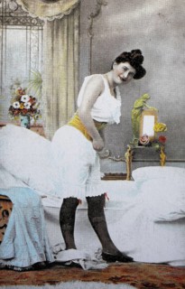 Female nude from around 1899, erotic postcard, playgirl, woman in historical underwear dressing in