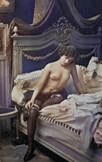 Female nude from around 1899, erotic postcard, Playgirl, A woman sits thoughtfully on a bed in a