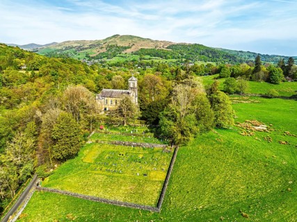 Holy Trinity Church from a drone, Bog Lane, Brathay village, Lake District, Cumbria, England,