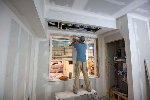 Romulus, Michigan - Workers build apartments in Ginosko Modular 's factory using modular