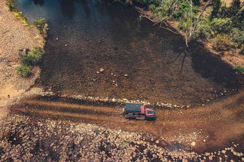 Landrover crosses river in Australian outback in the Kimberley, North West Australia, Australia