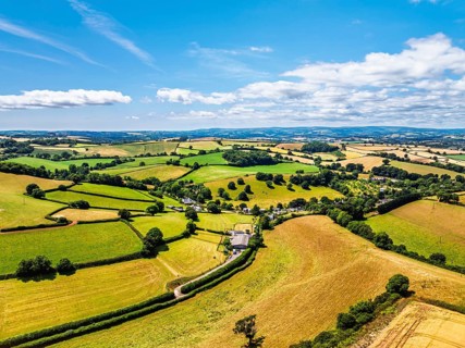 DefaultFarms and Fields over Torquay from a drone, Devon, England, United Kingdom