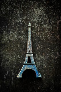 Vibrant blue Eiffel Tower keychain highlights detailed craftsmanship as it stands out against a