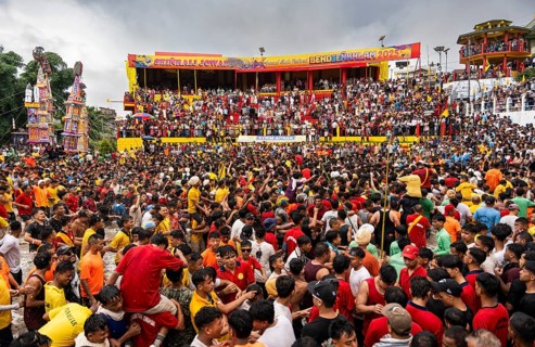 People from the Pnar community march in a circle as they celebrate an event organized to mark the
