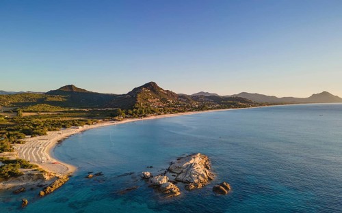 The light of the newly risen sun illuminates the Costa Rei, a stretch of coastline on the Italian