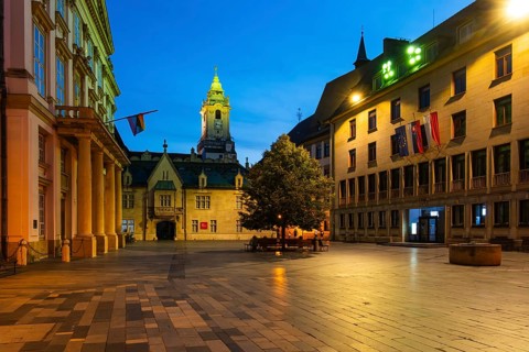 Night shot of Primitial Square with New and Old Town Hall and Primitial Palace in the historic