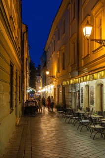 Cosy alley in the old town with illuminated cafés in Bratislava, Slovakia