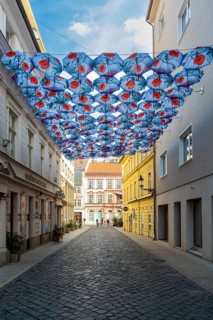 Many umbrellas with poppies over an alley in front of the Nedbalka GalleryBratislava, Slovakia