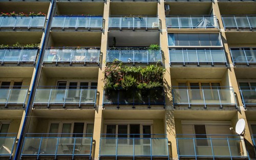 Balcony filled with flowers and plants on an apartment building in the city centre of Bratislava,