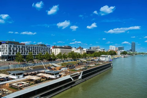 View of the banks of the Danube and the Bratislava skyline from the Bridge of the Slovak National