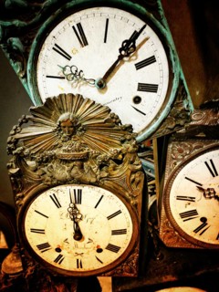 A collection of vintage clocks showcasing ornate craftsmanship and classic styling. Each clock