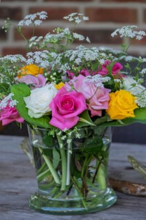 Small bouquet of flowers in a glass jar, Germany