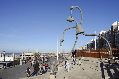 Sculpture Herring Esser by artist Tom Otterness on the seafront promenade, Scheveningen, The Hague,