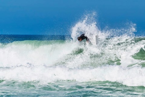 Surfer riding a wave on Contis beach, Saint Julien en Born, Saint-Julien-en-Born, Landes, France