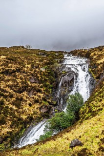 Eas a' Bhradain waterfall, Red Cuillin mountains, Loch Ainort, Isle of Skye, Scotland, UK