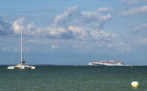 Boats on sea over Knoll Beach Studland, Poole, Dorset, England, United Kingdom