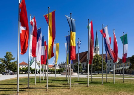 National flags at Kapellplatz with the collegiate parish church of St Philip and St James, place of