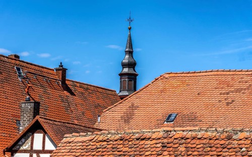 The old town centre with half-timbered houses, church towers and remains of the town wall in