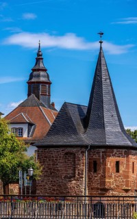 The old town centre with the town wall and the Seemenbach stream, Büdingen, Hesse, Germany