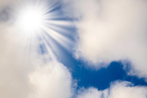 Symbolic image, global warming, heat, bright sunshine penetrates thin clouds and illuminates the