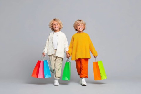 Children with colourful shopping bggs, AI generated