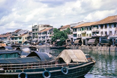 Port activity, boats and vehicles waterfront of Singapore River, Singapore, southeast Asia c 1963