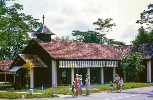 European women and children outside Christian chapel or church, from a series about Singapore and