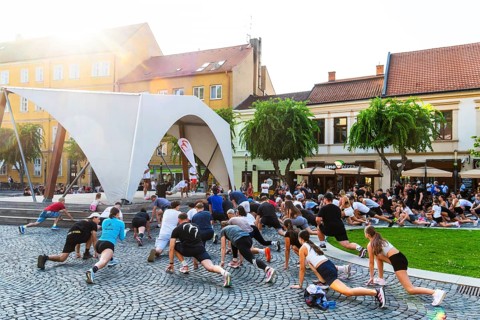 An event by a local fitness centre takes place on a stage on Peace Square, Capital of Culture 2026,