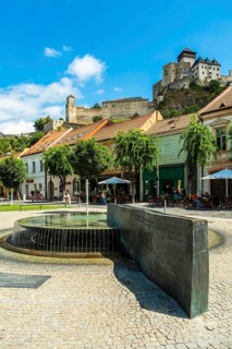 Mark Aurel fountain and fountain on Peace Square with Trencin Bridge in the background, Capital of